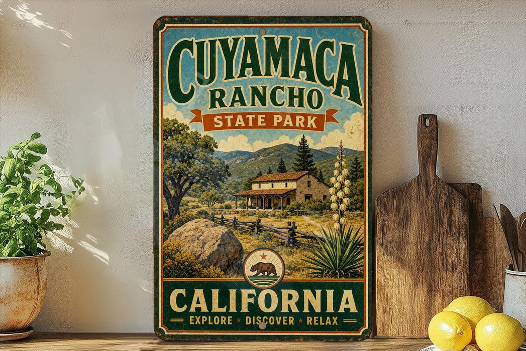 a vintage-style sign for Cuymacacho Ranch State Park in California, with a scenic illustration of a house, trees, and mountains. The sign is displayed on a wooden shelf, surrounded by various kitchen utensils and a potted plant.