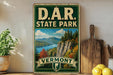 A vintage-style sign for Vermont State Park, featuring a scenic mountain landscape with a lake and pine trees.