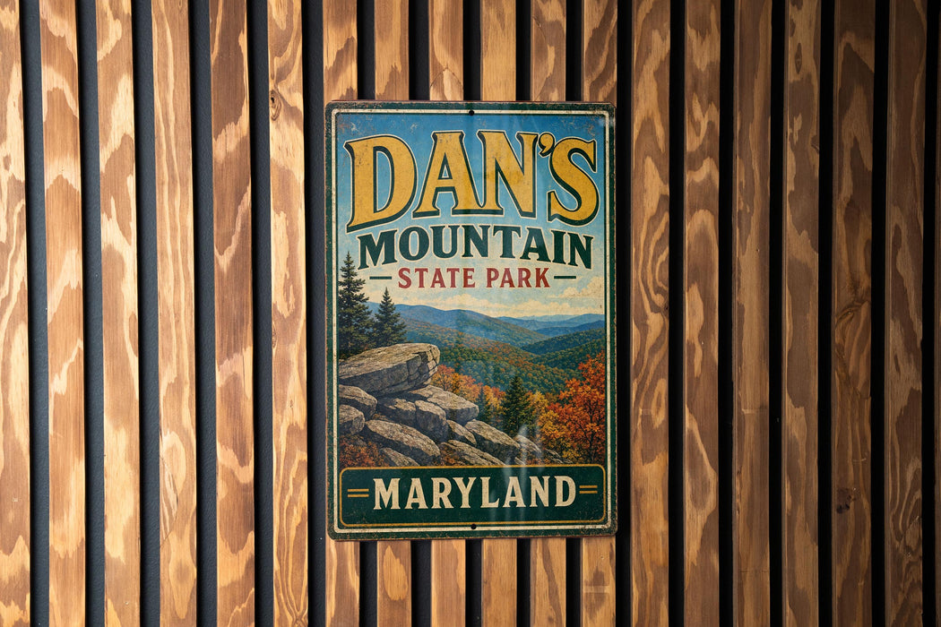 A vintage metal sign for Dan's Mountain State Park in Maryland, featuring a scenic mountain landscape.