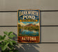 A vintage-style sign for Dankworth Pond State Park in Arizona, featuring a scenic landscape with mountains, a lake, and a bird.