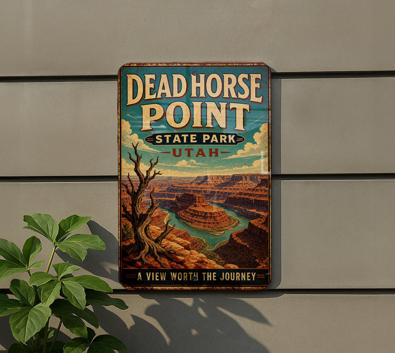 A vintage-style metal sign for Dead Horse Point State Park in Utah, featuring a scenic illustration of the Grand Canyon.