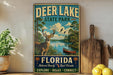 A vintage-style sign for Deer Lake State Park in Florida, featuring a deer, a canoe, and a scenic landscape.