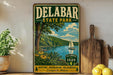 A vintage-style sign for Delabar State Park, featuring a scenic illustration of a lake, trees, and a sailboat, along with the text "ILLINOIS est. 1949 NATURE - RECREATION - RELAXATION Escape to Nature".