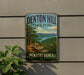 A vintage metal sign for Denton Hill State Park in Pennsylvania, featuring a scenic landscape with a lake and mountains.