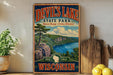 A vintage-style sign for Devil's Lake State Park in Wisconsin, featuring a scenic landscape with a lake, mountains, and a pine tree.