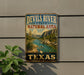 A vintage-style metal sign for the Devils River State Natural Area in Texas, featuring a scenic landscape with a river, mountains, and desert vegetation.