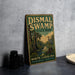 a vintage-style sign for Dismal Swamp State Park in North Carolina, with a bird illustration and text that reads "North Carolina Naturally Mysterious, Unique Carolina".