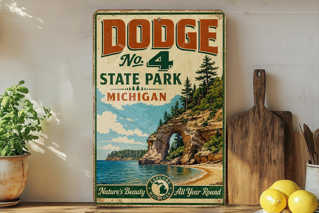 A vintage Dodge sign advertising No. 4 State Park in Michigan, featuring a scenic landscape with a lake, cliffs, and pine trees.