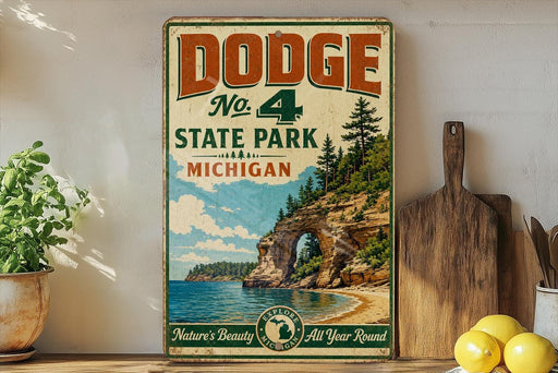 A vintage Dodge sign advertising No. 4 State Park in Michigan, featuring a scenic landscape with a lake, cliffs, and pine trees.
