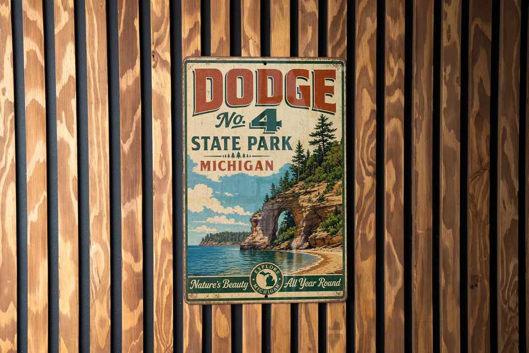 A vintage metal sign for Dodge State Park in Michigan, featuring a scenic illustration of a cliff overlooking a lake.