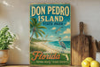 a vintage-style sign for Don Pedro Island, Florida, with a beach scene and a bird in flight.