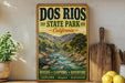 a vintage-style sign for the state park, with a scenic illustration of a river and mountains in the background.