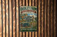 A vintage metal sign for Dudley Farm Historic State Park in Florida, featuring an illustration of a farm scene with a tractor and orange trees.