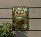 A vintage-style metal sign for Dunbar Cave State Park in Tennessee, featuring a scenic illustration of the cave and the words "Adventure Awaits".
