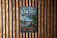 A vintage-style sign for E.P. "Tom" Sawyer State Park in Kentucky, featuring a scenic illustration of a river and two people fishing.