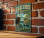 A vintage-style metal sign for Eagle Creek State Park in Illinois, featuring an eagle and a river scene.