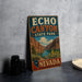 A vintage-style metal sign for Echo Canyon State Park in Nevada, featuring a scenic illustration of the canyon landscape.