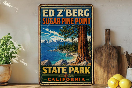 A vintage-style sign for Ed Z'berg Sugar Pine Point State Park, California, featuring a scenic image of a pine tree and mountains.
