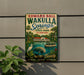 A vintage-style sign for Edward Ball Wakulla Springs State Park, Florida, featuring a tropical landscape with palm trees, a manatee, and a boat on the water.