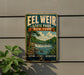 A vintage-style metal sign for Eel Weir State Park in New York, featuring a scenic illustration of a waterfall and forest.