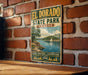 A vintage metal sign for El Dorado State Park in Kansas, featuring a scenic landscape with a lake, trees, and a sailboat.