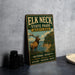 A vintage metal sign for Elk Neck State Park, Maryland, featuring an illustration of a deer in a natural setting.