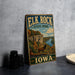A vintage-style metal sign for Elk Rock State Park in Iowa, featuring an illustration of a scenic landscape with a deer and a river.