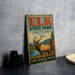 A vintage-style metal sign for the Elk State Park in Pennsylvania, featuring an illustration of a deer with antlers and a scenic landscape.