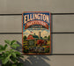 A vintage-style metal sign for the Ellington Agricultural Center in Tennessee, featuring a farm scene with a red tractor and barn.