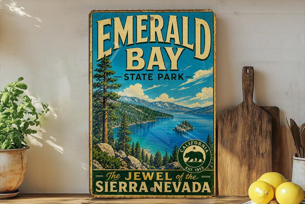 A vintage-style sign for Emerald Bay State Park, featuring a scenic landscape with a lake, mountains, and pine trees.