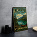 A vintage-style sign for Emerald Lake State Park in Vermont, featuring a scenic landscape with a lake, mountains, and a canoe.
