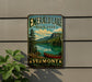 A vintage-style metal sign for Emerald Lake State Park in Vermont, featuring a scenic landscape with a lake, mountains, and a canoe.