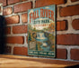 A vintage-style metal sign for Fall River State Park in Kansas, featuring a scenic illustration of a waterfall and forest.