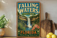 A vintage-style poster of Falling Waters State Park in Florida, featuring a waterfall surrounded by lush greenery and tropical flowers.