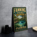 A vintage-style metal sign for Fanning Springs State Park in Florida, featuring a scenic image of a river and a wooden bridge.