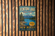 A vintage-style metal sign for Fenton Lake State Park in New Mexico, featuring a scenic landscape with mountains, trees, and a lake.
