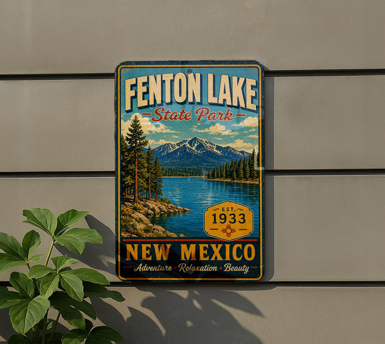 A vintage-style metal sign for Fenton Lake State Park in New Mexico, featuring a scenic mountain landscape and a lake.