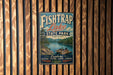 A vintage-style sign for Fish Trap Lake State Park in Kentucky, featuring a scenic illustration of a lake surrounded by mountains and a boat.