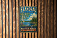 A vintage metal sign for Flandrau State Park, featuring a scenic image of a lake surrounded by trees and mountains.