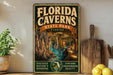 A vintage-style metal sign for Florida Caves State Park, featuring an illustration of the cave system and the text "FLORIDA CAVENS STATE PARK EXPLORE UNDERGROUND BEAUTY" in a warm color palette.