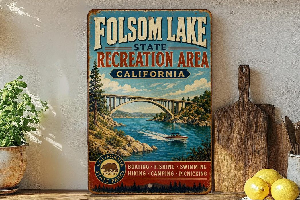 a vintage-style metal sign for Folsom Lake State Recreation Area in California, with a scenic illustration of a bridge, water, and mountains.