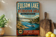 a vintage-style metal sign for Folsom Lake State Recreation Area in California, with a scenic illustration of a bridge, water, and mountains.