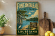 a vintage-style sign for Fountainbleau State Park in Louisiana, with a scenic illustration of a bay and a bird in the foreground.