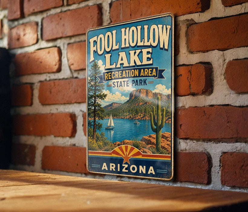 A vintage-style metal sign for Foolhole Lake, a recreation area in Arizona State Park, featuring a scenic landscape with a lake, mountains, and a sailboat.