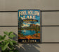 A vintage-style sign for Foolhole Lake, a recreation area in Arizona, featuring a scenic landscape with a lake, mountains, and a sailboat.