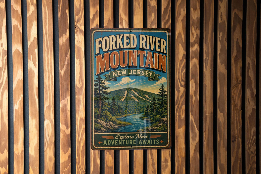 A vintage-style metal sign for the Forked River Mountain in New Jersey, featuring a scenic mountain landscape with pine trees and a river.