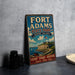 A vintage-style sign for Fort Adams State Park in Rhode Island, featuring a scenic image of the park and its surroundings.