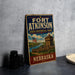 A vintage-style metal sign for Fort Atkinson State Historical Park in Nebraska, featuring an illustration of a fort and a river.
