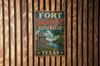 A vintage-style metal sign for Fort Boggby State Park in Texas, featuring a scenic illustration of the park's landscape.