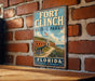 A vintage-style sign for Fort Clinch State Park in Florida, featuring an illustration of the fort and surrounding landscape.